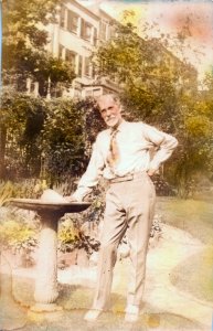 Reginald Pelham Bolton in common garden area behind his home